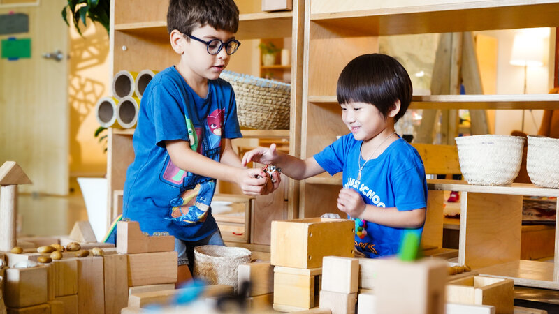 Photo of Early Years kids playing with wooden blocks